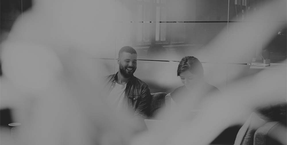 Man and woman laughing black and white